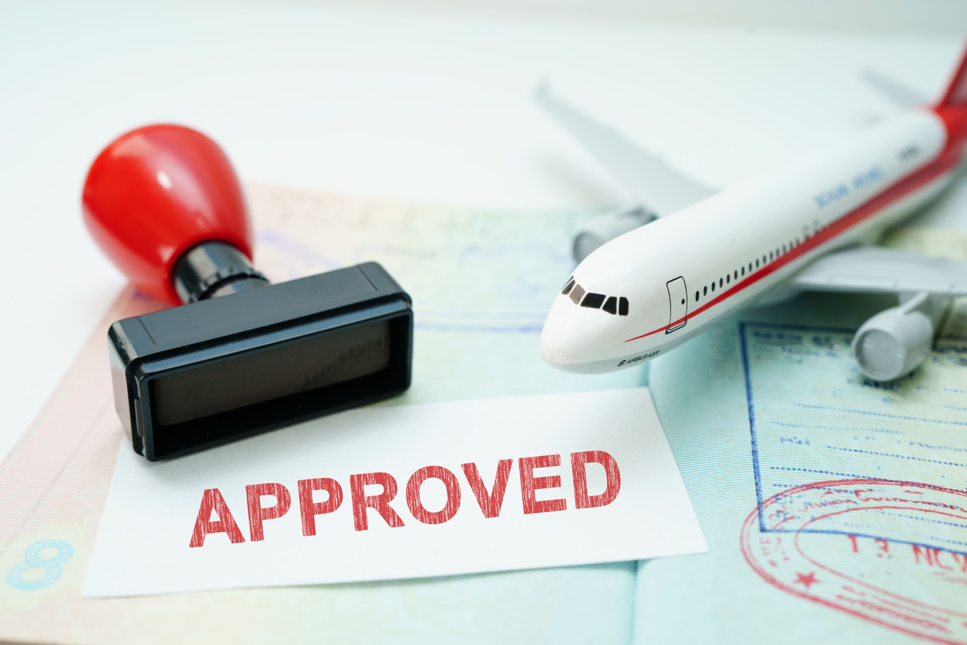 Passport with approved stamp on document for tourism to immigration at airport in country.