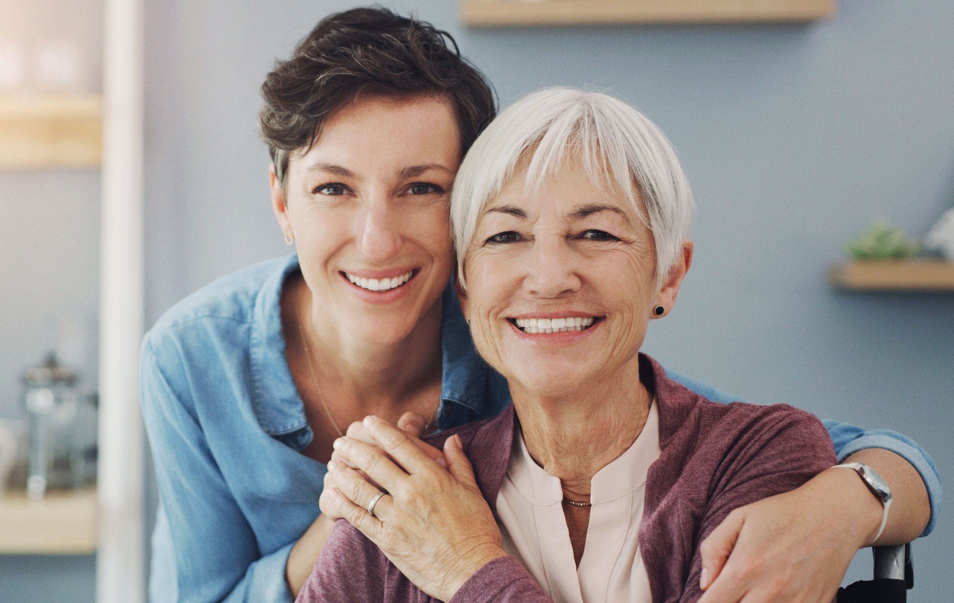 Senior woman, daughter and portrait in home with hug for family, love and support for retirement. Female people, happiness and together in house with care or kindness, mom with child for relax
